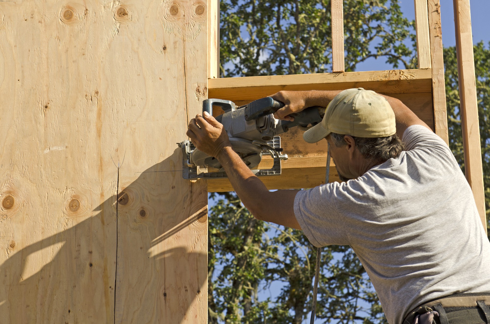 Contruction Worker Installing Siding