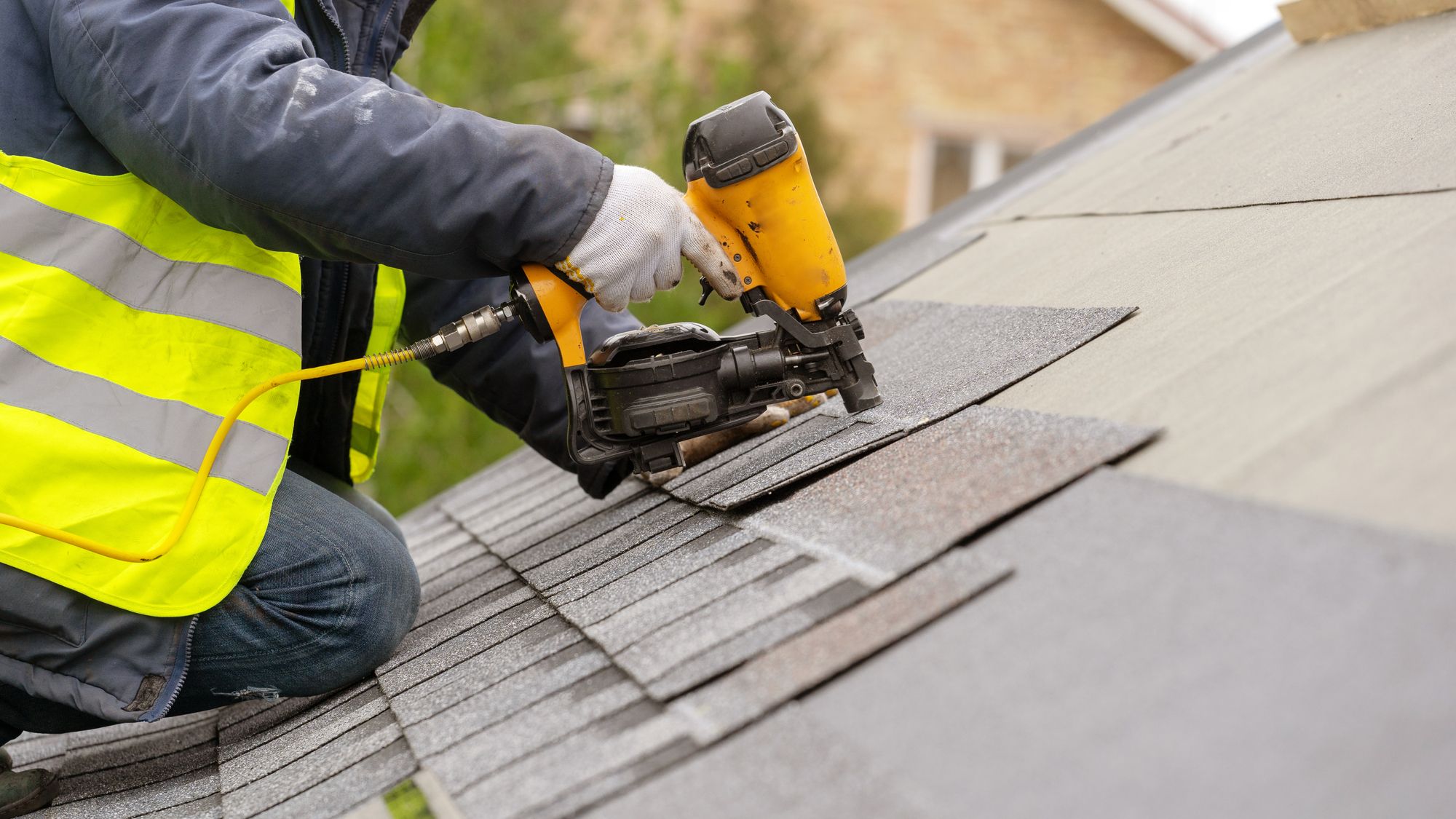 Man Fixing The Roof